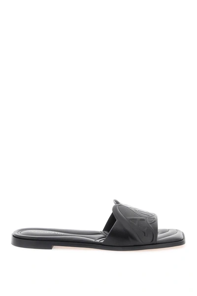 Shop Alexander Mcqueen Leather Slides With Embossed Seal Logo