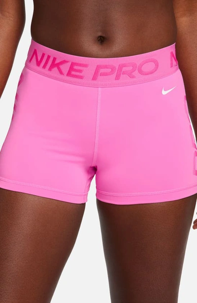 Shop Nike Pro Dri-fit Mid Rise Training Shorts In Playful Pink/ Pink/ White