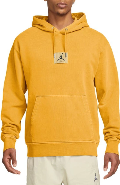 Shop Jordan Flight Essentials Washed Fleece Cotton Hoodie In Yellow Ochre