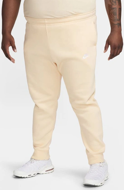 Shop Nike Sportswear Club Pocket Fleece Joggers In Ice Peach/ Ice Peach/ White