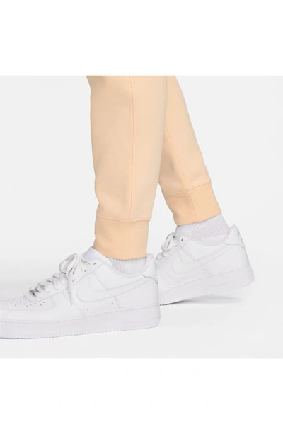 Shop Nike Sportswear Club Pocket Fleece Joggers In Ice Peach/ Ice Peach/ White