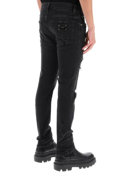 Shop Dolce & Gabbana Ripped Skinny Jeans Men In Black