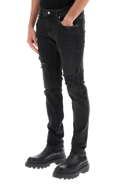 Shop Dolce & Gabbana Ripped Skinny Jeans Men In Black
