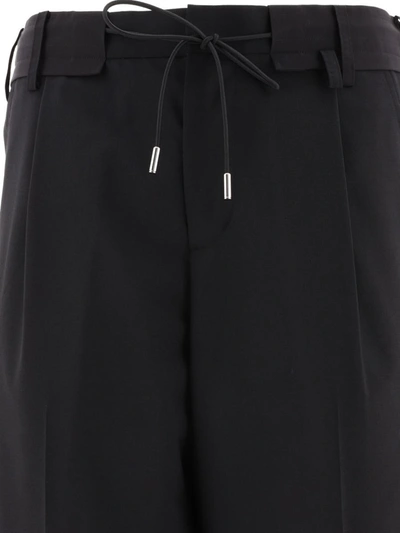 Shop Sacai Tapered Drawstring Trousers In Black