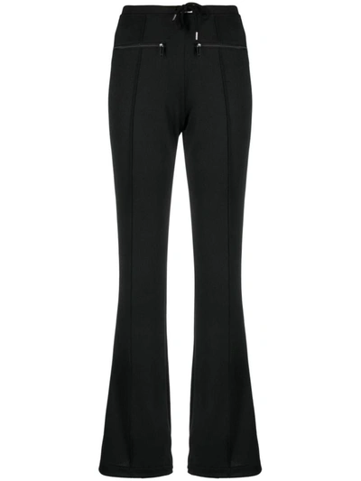 Shop Courrèges Logo-patch Drawstring Flared Trousers In Black