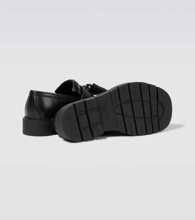 Shop Bottega Veneta Haddock Fringed Leather Loafers In Black