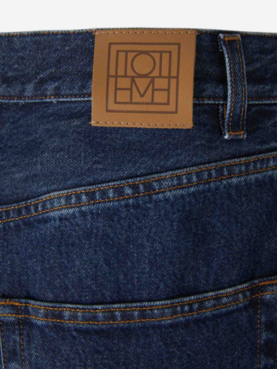 Shop Totême Cotton Tapered Jeans In Dark Denim Blue