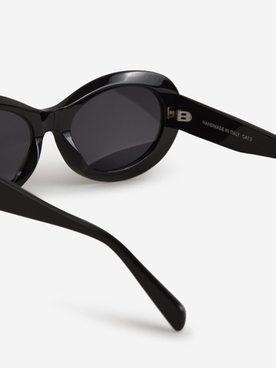 Shop Totême Oval Sunglasses In Black