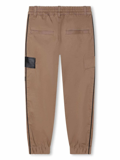 Shop Givenchy Kids Trousers Beige