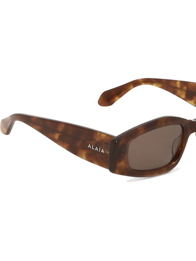 Shop Alaïa Sunglasses With Geometric Shape
