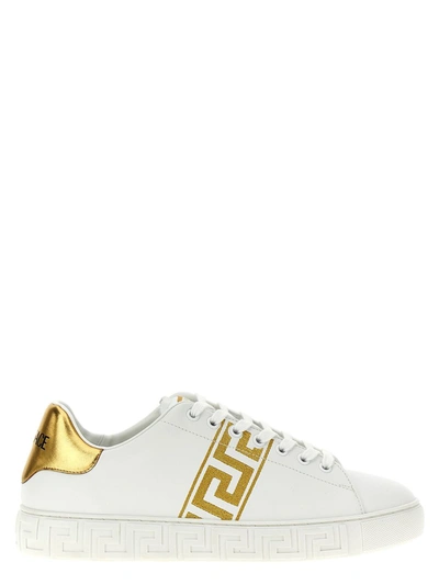 Shop Versace Greca Embroidered Sneakers In Golden