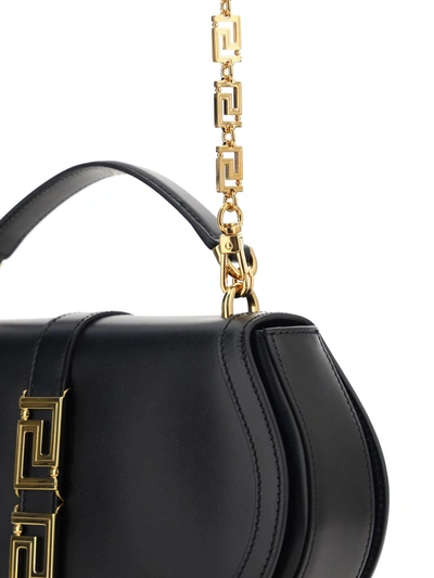 Shop Versace Top Handle Bags In Black