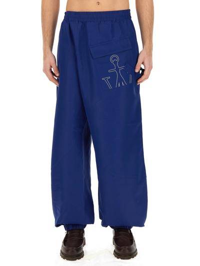 Shop Jw Anderson Joggers Pants With Logo Anchor In Blue