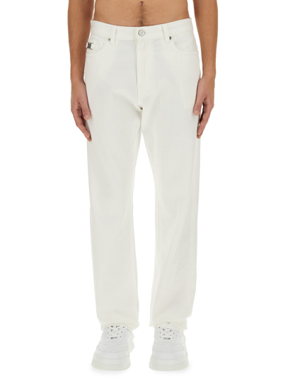 Shop Versace Regular Fit Jeans In White