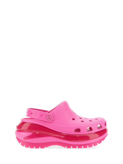 Shop Crocs Mega Crush Clogs In Pink