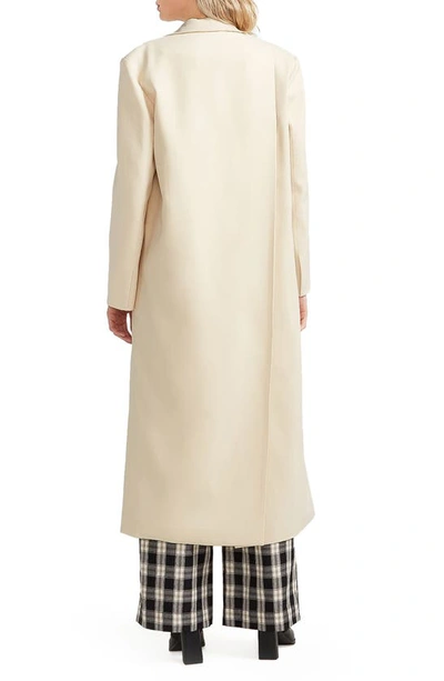 Belle & Bloom Transcendent Asymmetric Split Hem Coat In French Vanilla