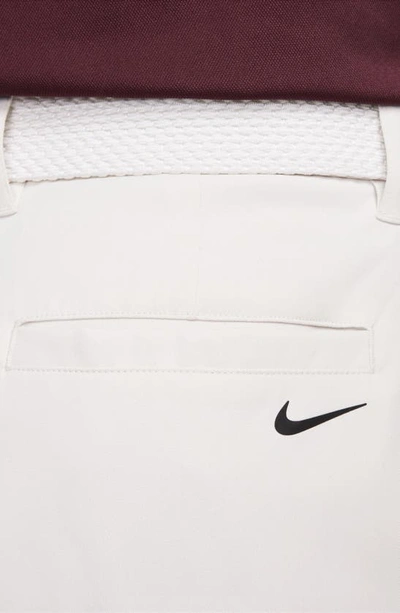 Shop Nike Dri-fit 8-inch Water Repellent Chino Golf Shorts In Light Bone/ Black