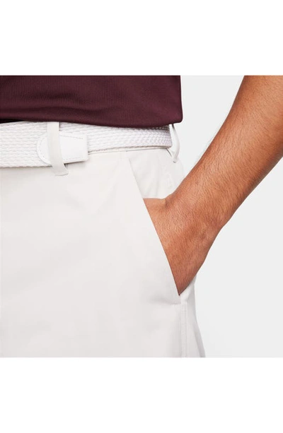 Shop Nike Dri-fit 8-inch Water Repellent Chino Golf Shorts In Light Bone/ Black