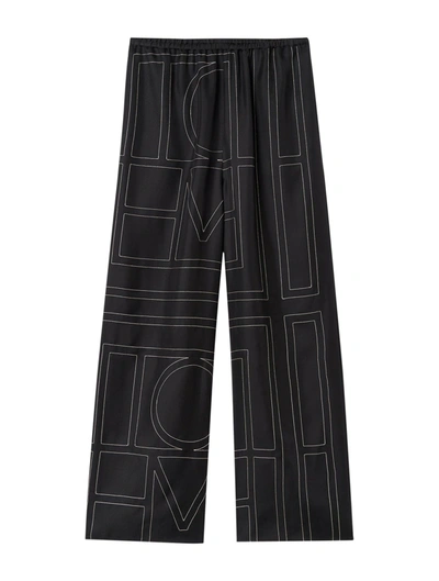 Shop Totême Monogram Silk Pants In Black