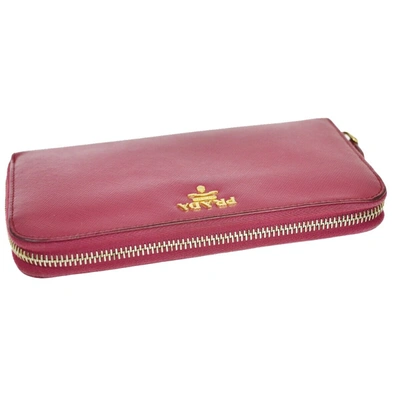 Shop Prada Round Zipper Pink Leather Wallet  ()