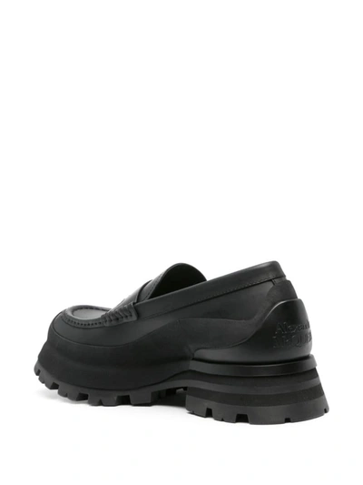 Shop Alexander Mcqueen Seal Logo Leather Loafers In Black