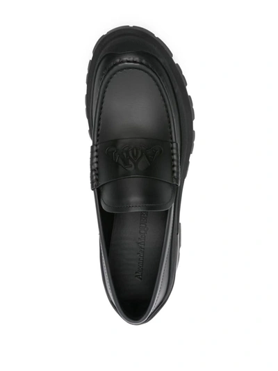 Shop Alexander Mcqueen Seal Logo Leather Loafers In Black