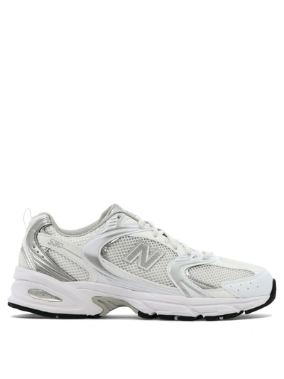 Shop New Balance "530" Sneakers In White