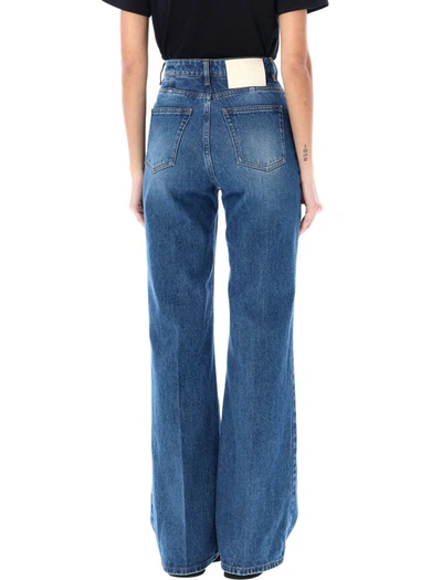 Shop Ami Alexandre Mattiussi Ami Paris Flared Denim Jeans In Used Blue