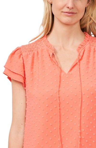 Shop Cece Tie Neck Flutter Sleeve Top In Cameo Coral