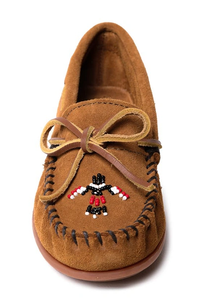 Shop Minnetonka Kids' Thunderbird 'animikii' Slip-on Shoe In Brown