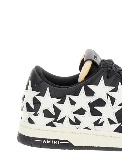 Shop Amiri 'stars Court' Black And White Low Top Sneakers With Star Patches In Leather Man