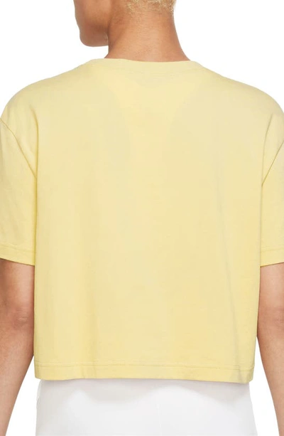 Shop Nike Sportswear Essential Crop Graphic Tee In Soft Yellow