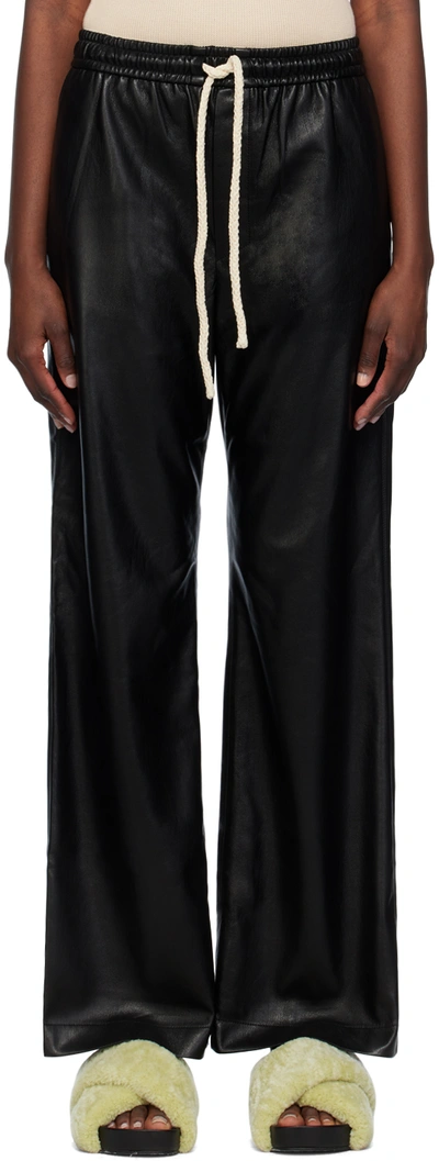 Shop Nanushka Black Gisela Vegan Leather Trousers In Black/creme