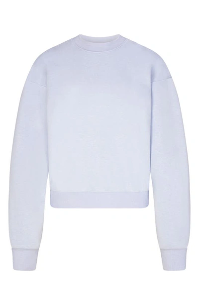 Shop Skims Cotton Blend Fleece Classic Crew Sweatshirt In Periwinkle