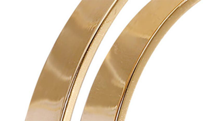 Shop Vince Camuto Clearly Disco Double Hoop Earrings In Gold Tone