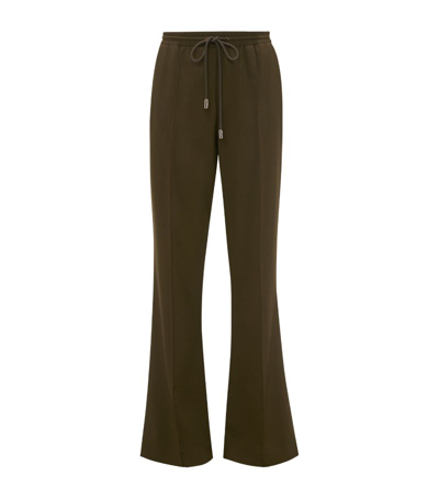 Shop Jw Anderson Stretch-wool Drawstring Tailored Trousers In Green