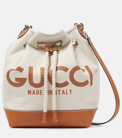 Shop Gucci Logo Leather-trimmed Canvas Bucket Bag In Beige