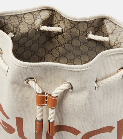 Shop Gucci Logo Leather-trimmed Canvas Bucket Bag In Beige