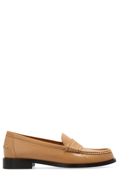 Shop Ferragamo Irina Logo Embossed Loafers In Beige