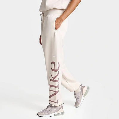 Shop Nike Women's Sportswear Oversized Logo Phoenix Fleece Jogger Sweatpants In Light Orewood Brown/smokey Mauve/sail
