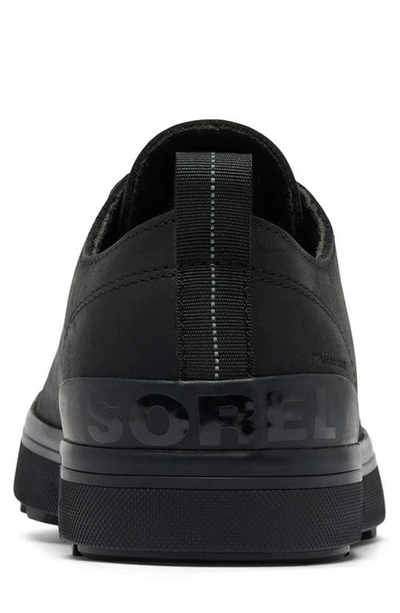 Shop Sorel Metro™ Ii Waterproof Sneaker In Black/ Sea Salt