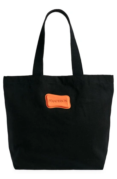 Shop Jw Anderson Logo Embroidered Canvas Tote In Black