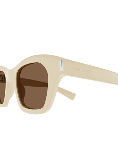 Shop Saint Laurent Cat-eye Frame Sunglasses In 004 Ivory Ivory Brown