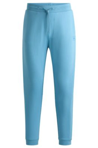 Shop Hugo Boss Cotton-terry Tracksuit Bottoms With Logo Patch In Light Blue