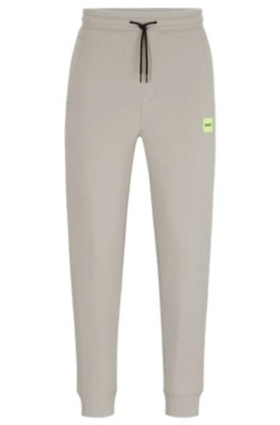 Shop Hugo Cotton-terry Tracksuit Bottoms With Red Logo Label In Light Grey