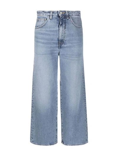 Shop Totême Flared Jeans In Blue