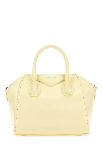 Shop Givenchy Handbags. In Yellow