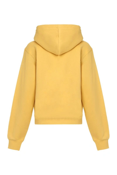 Shop Saint Laurent Cotton Hoodie In Yellow