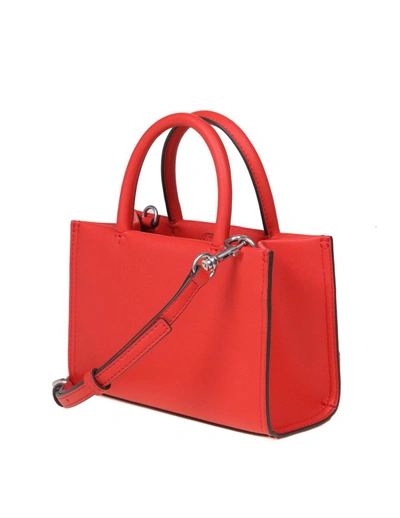 Shop Tory Burch Micro Leather Handbag In Red