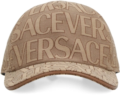 Shop Versace All Over Logo Baseball Cap In Beige